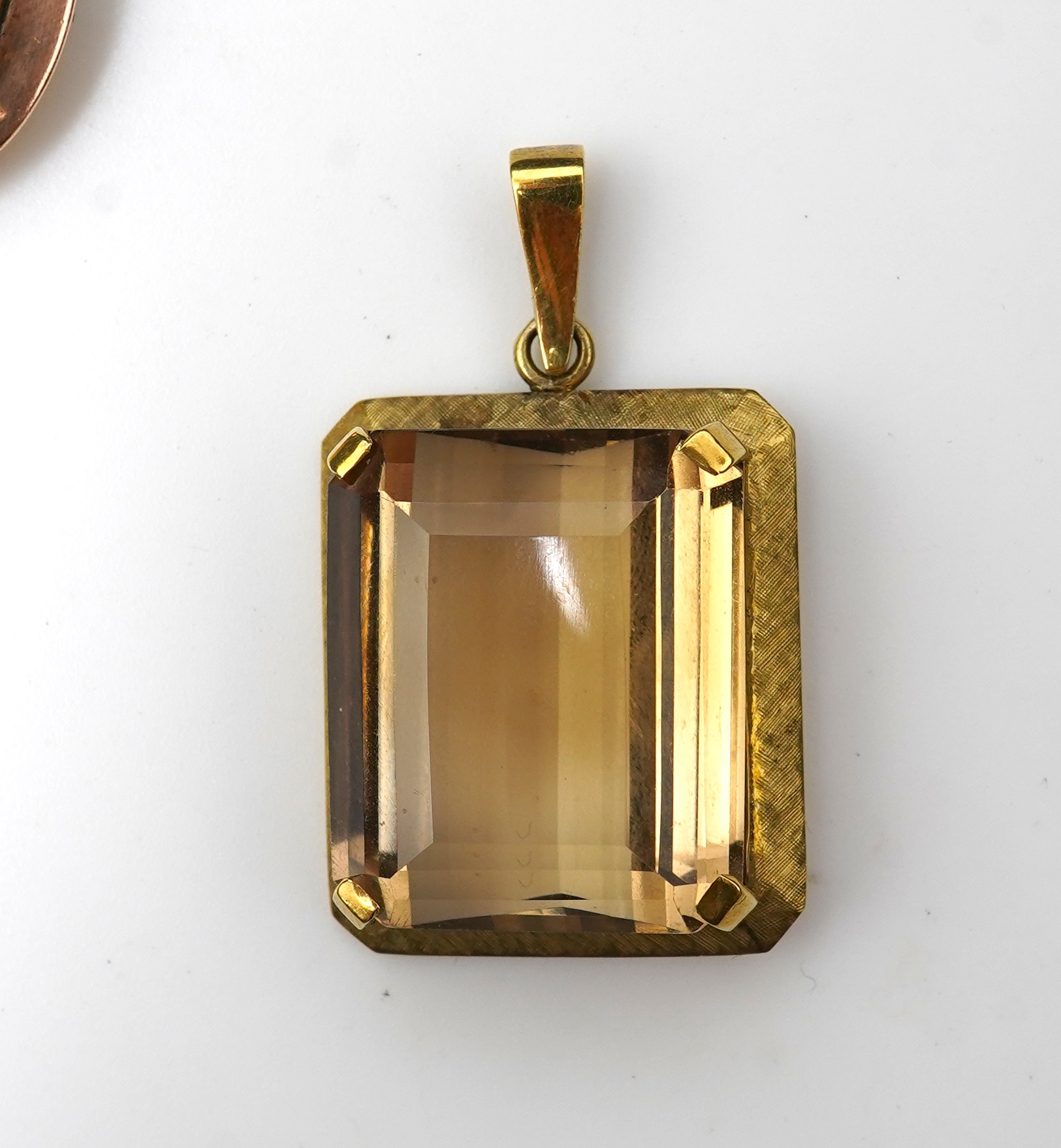 A citrine brooch and pendant, and onyx stickpin